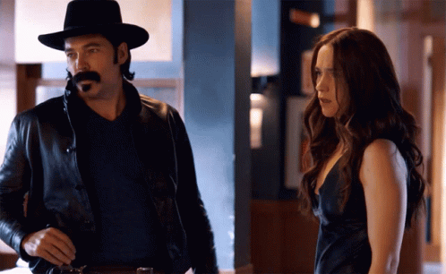 Man With Mustache And Woman In Black Dress GIF