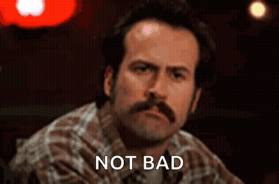 Man With Mustache At Bar Saying Not Bad GIF