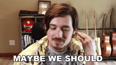 Man With Mustache At Microphone Saying Maybe We Should GIF