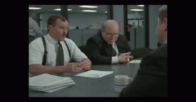 Man With Mustache At Table With Two Men In Suits GIF