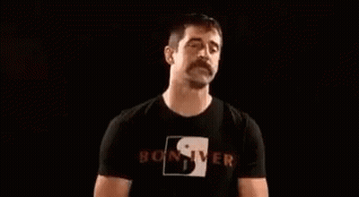 Man With Mustache Blowing Smoke GIF