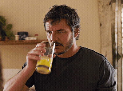 Man With Mustache Drinking Orange Juice Through Straw GIF