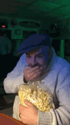 Man With Mustache Eating Popcorn