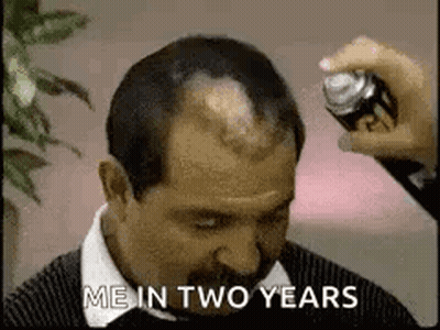 Man With Mustache Getting Hair Sprayed GIF