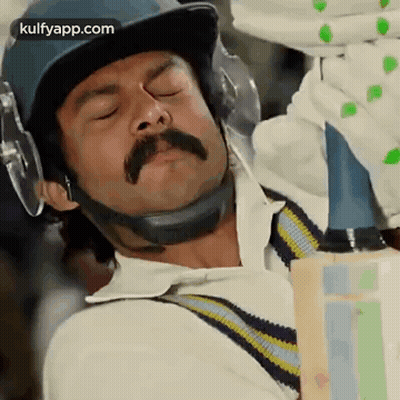 Man With Mustache Holding Cricket Bat GIF