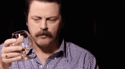 Man With Mustache Holding Glass of Water