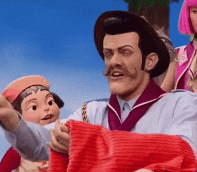 Man With Mustache Holding Red Blanket Next To Cartoon Character GIF