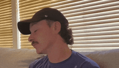 Man With Mustache In Black Hat And Blue Shirt GIF