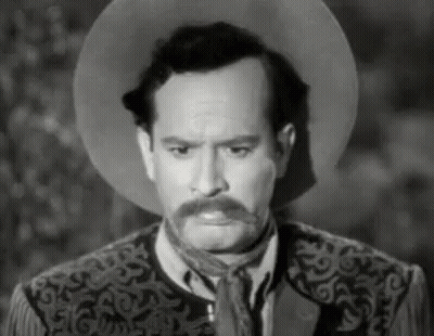 Man With Mustache In Cowboy Hat And Vest GIF
