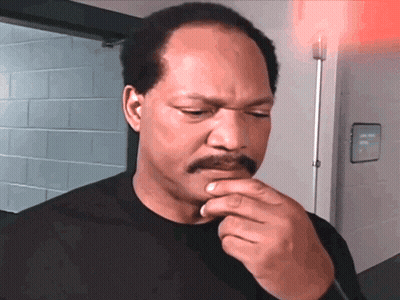 Man With Mustache In Front Of Emergency Exit Sign GIF