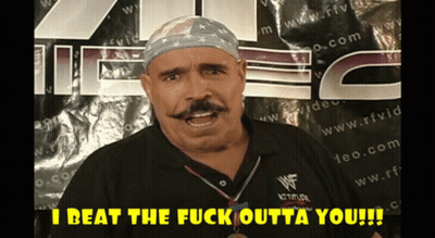 Man With Mustache In Front Of Sign Saying I Beat The Fuck Outta You GIF