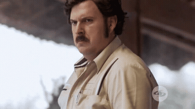 Man With Mustache In Front Of TV Sign GIF