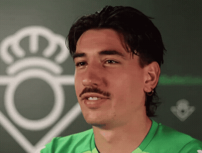 Man With Mustache In Green Shirt And White Crown GIF