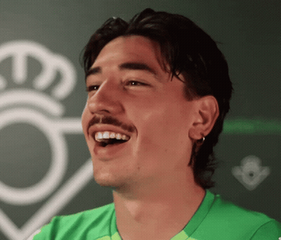 Man With Mustache in Green Shirt Smiling