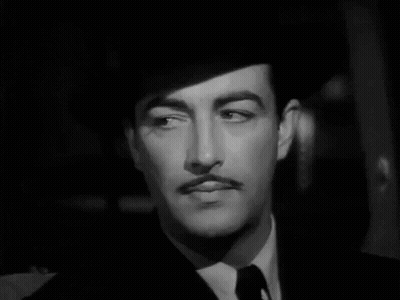 Man With Mustache In Hat And Tie GIF