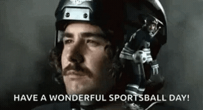 Man With Mustache In Helmet Holding Football And Soccer Ball GIF