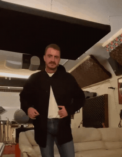 Man With Mustache In Living Room GIF