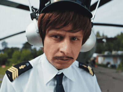 Man With Mustache In Pilot Hat And Ear Protectors GIF