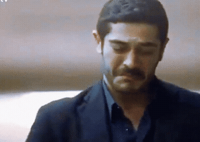 Man With Mustache In Suit Looking Down Eyes Closed GIF
