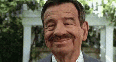 Man With Mustache In Suit Smiling GIF