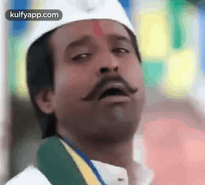 Man With Mustache In White Hat And Green Scarf GIF