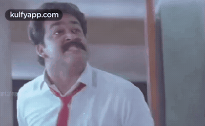 Man With Mustache in White Shirt and Red Tie Making Funny Face