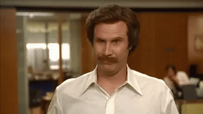 Man With Mustache In White Shirt And Tie Standing In Office GIF