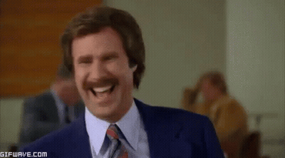 Man With Mustache Laughing In Suit And Tie GIF