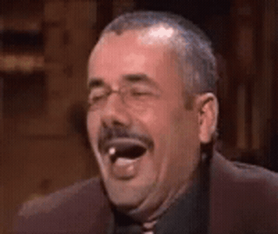 Man With Mustache Laughing With Tongue Out GIF