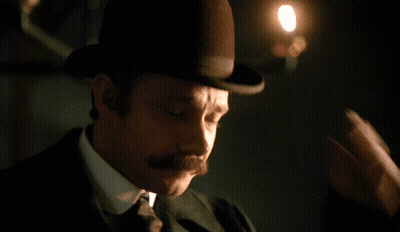 Man With Mustache Looking At Camera GIF