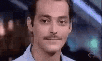 Man With Mustache Looking At Camera GIF