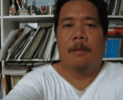 Man With Mustache Looking At Camera GIF