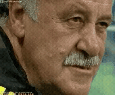 Man With Mustache Looking At Camera GIF
