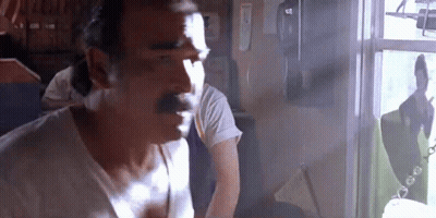 Man With Mustache Looking Out Window GIF