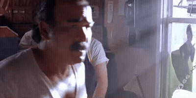 Man With Mustache Looking Out Window GIF