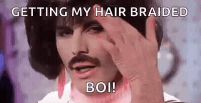Man With Mustache Making Funny Face And Braiding Hair GIF