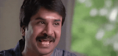 Man With Mustache Making Funny Face At Camera GIF