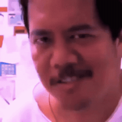 Man With Mustache Making Funny Face At Camera GIF