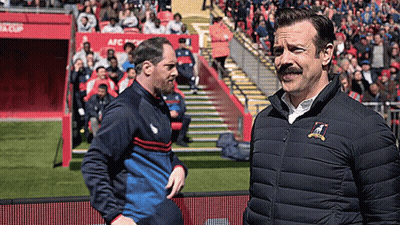 Man With Mustache On Soccer Field With Another Man GIF