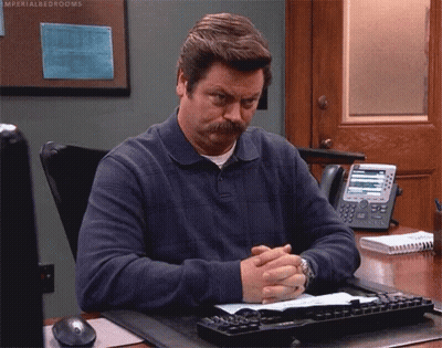 Man With Mustache Sitting At Desk Hands Folded GIF
