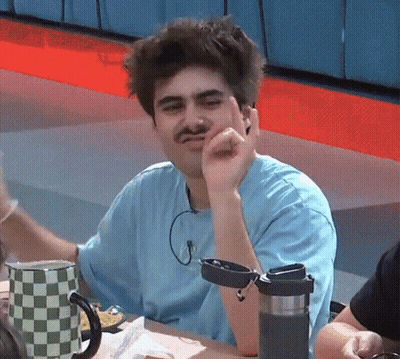 Man With Mustache Sitting At Table GIF