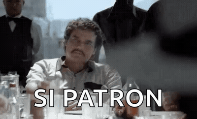 Man With Mustache Sitting At Table GIF