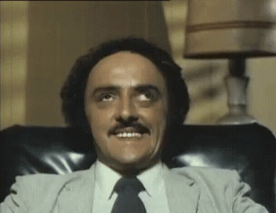 Man With Mustache Sitting In Chair Eyes Closed GIF
