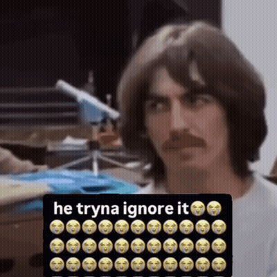 Man With Mustache Sitting In Front Of Sign Saying He Tryna Ignore It GIF