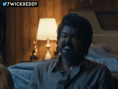 Man With Mustache Sitting Near Lamp GIF