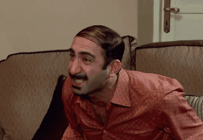 Man With Mustache Sitting On Couch Mouth Open GIF