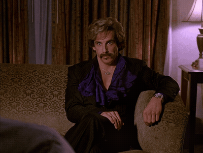 Man With Mustache Sitting On Couch Saying I Mean Come On GIF