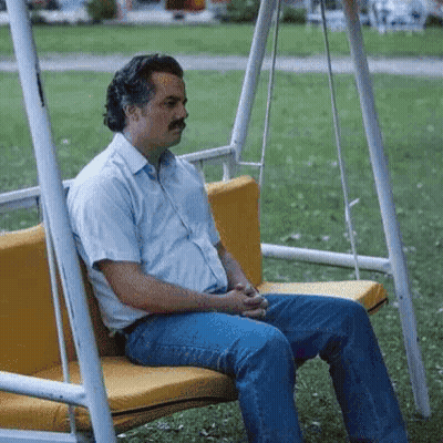 Man With Mustache Sitting On Swing GIF