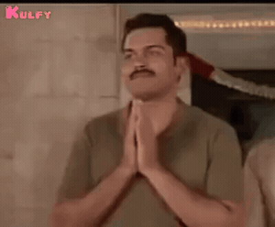 Man With Mustache Smiling Holding Hands Together GIF