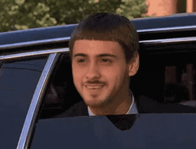Man With Mustache Smiling In Limousine GIF